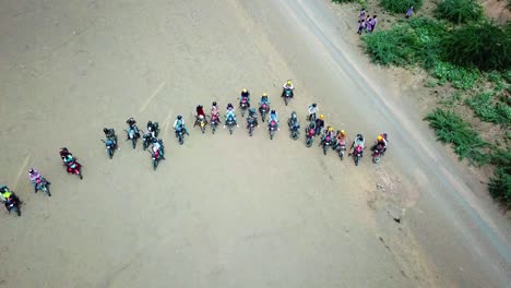 group of motorcycle riders ready to travel around lake magadi in kenya