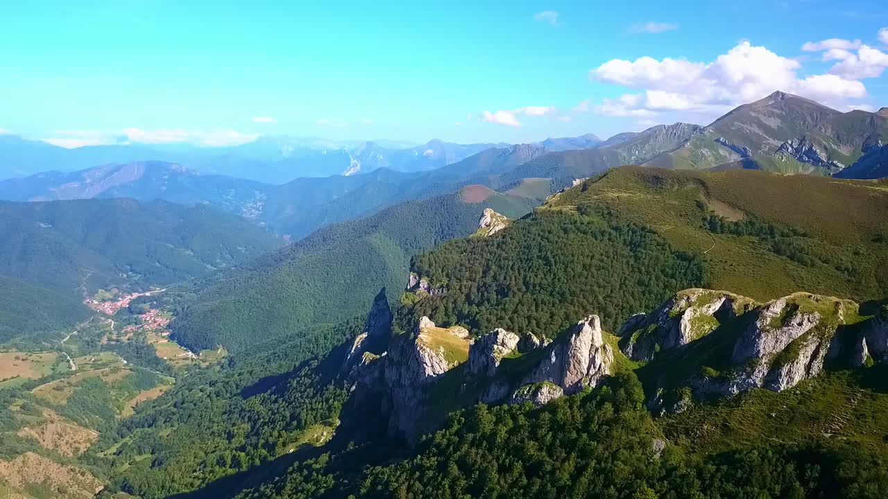 Drone's ascent over Picos: Peaks punctuate the skyline, a silent symphony of altitude