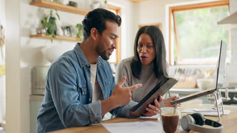 Kitchen,-talking-and-couple-with-a-tablet