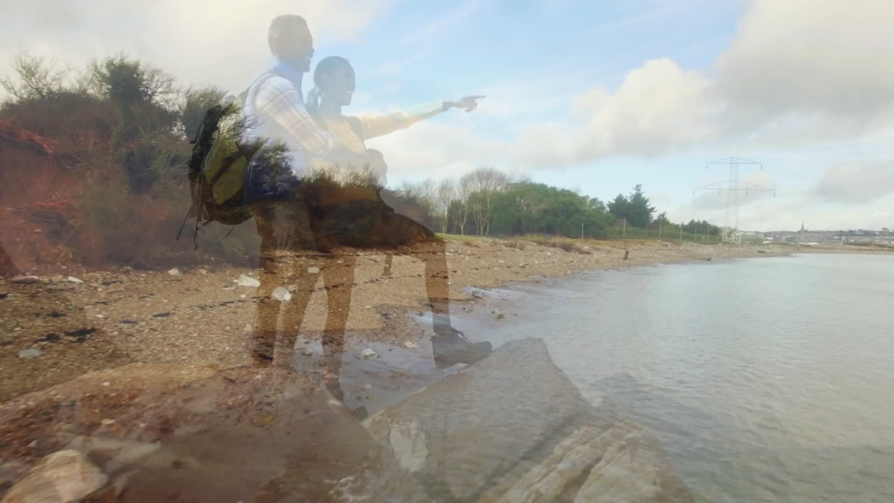 Hikers exploring rocky shoreline while pointing horizon with animated health and backpack icons