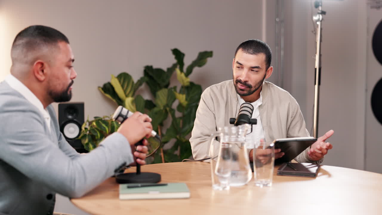 Two men recording a podcast in a studio