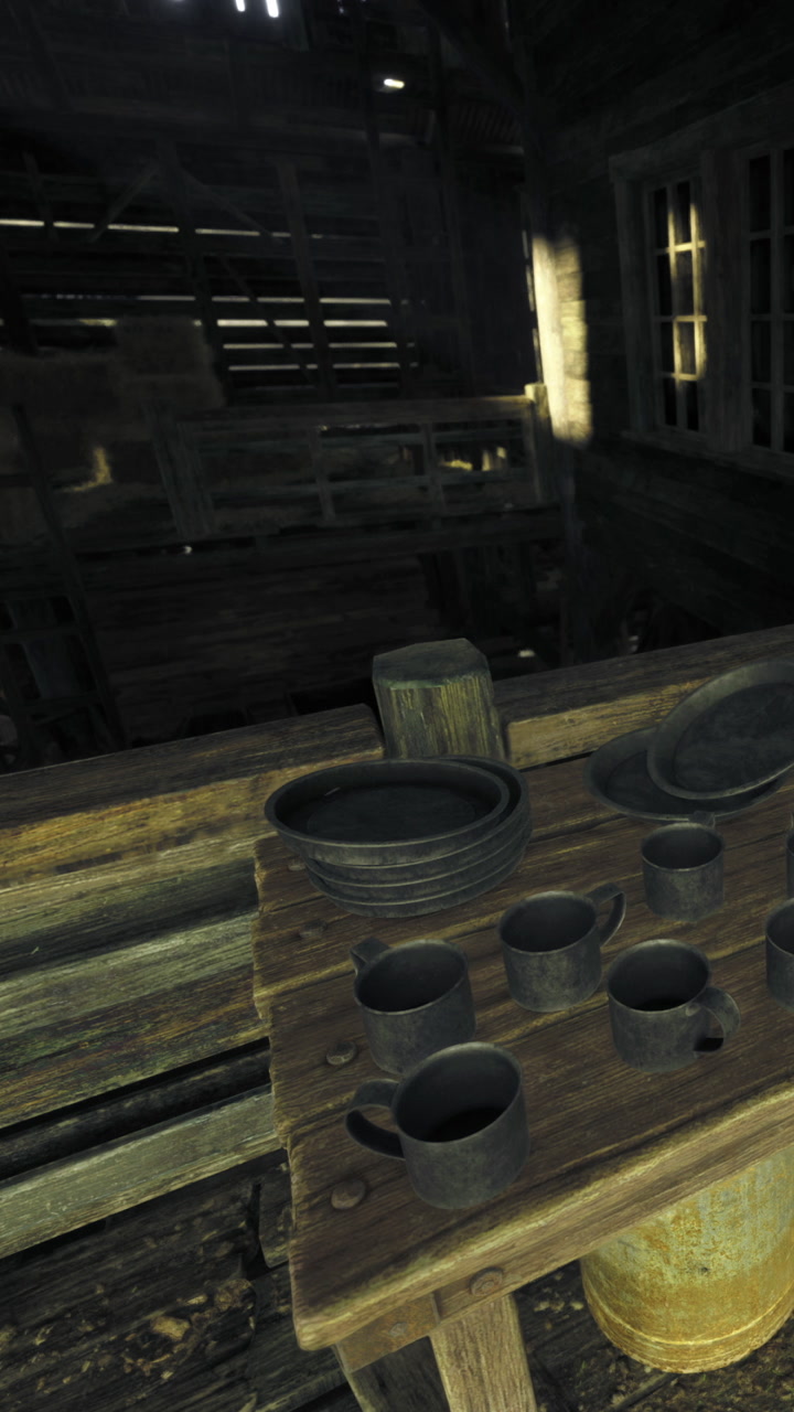 Dishes and cups arranged on a wooden table in an old cabin