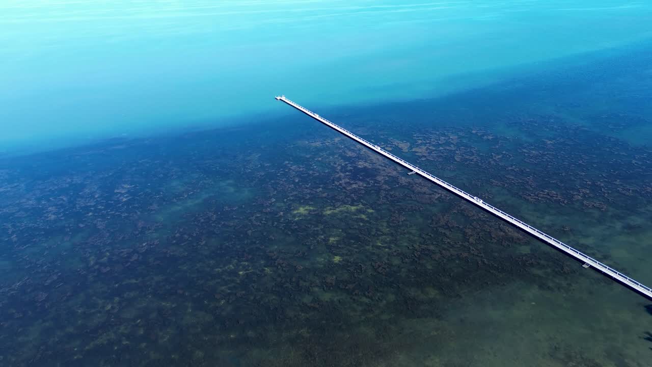 Drone aerial landscape of Long Jetty The Entrance pier dock wharf wooden boardwalk in lake river lagoon water fishing Central Coast tourism Australia peninsula rural town suburbs travel