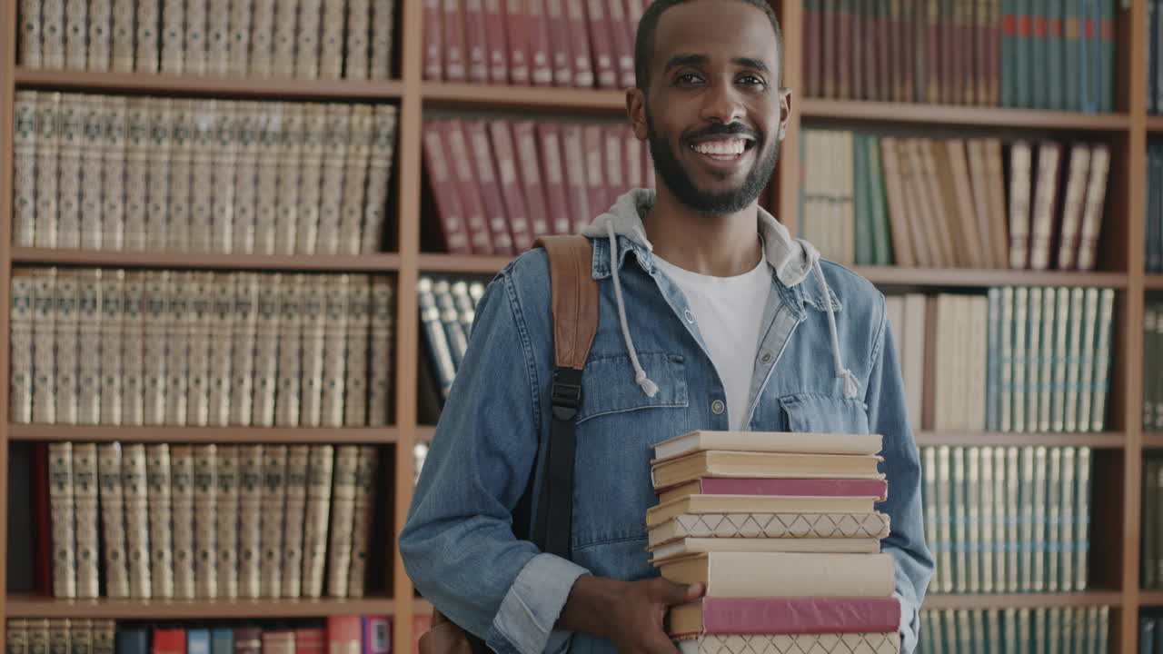 Smiling Student in Library with Books