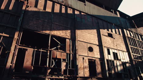 a stunning old abandoned industrial building in the light of the sunset