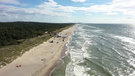 AERIAL:-Flying-Backwards-Above-Beautiful-Nida-Beach-with-Forest-and-Sea-on-Sides