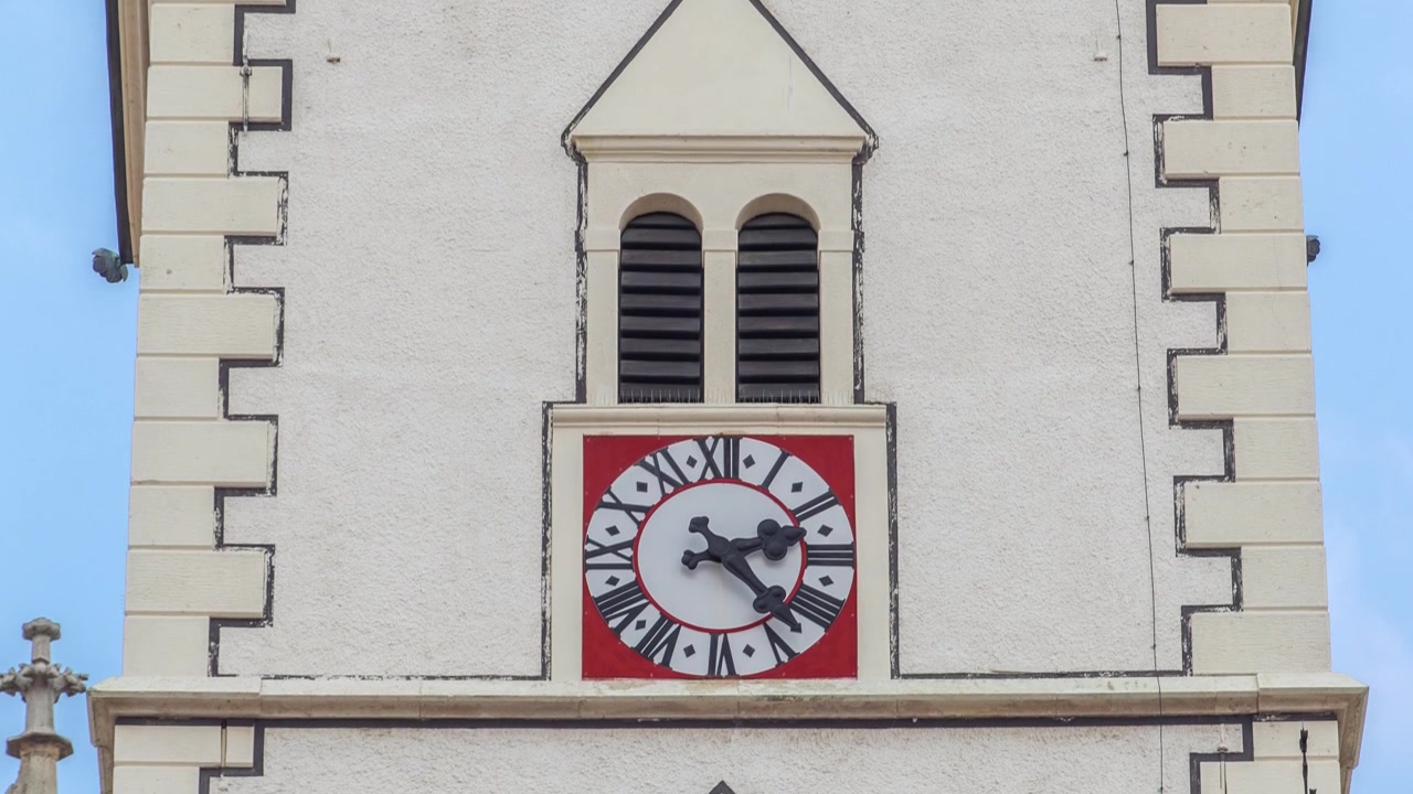 Clock on tower of St. Mark Church at St. Mark Square timelapse. Zagreb, Croatia. Close up view to watch face