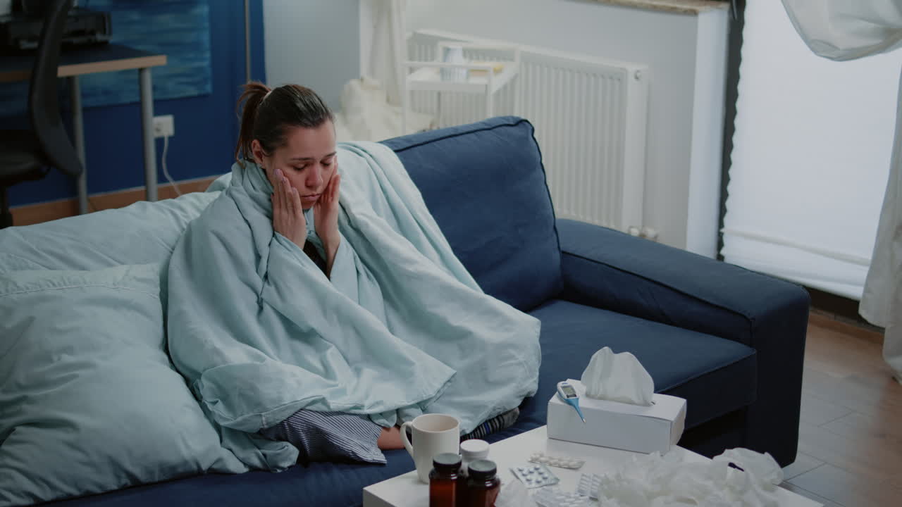 Sick woman rubbing temples and trying to cure headache