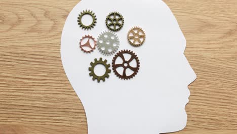 gears in a human head silhouette representing thought and mind
