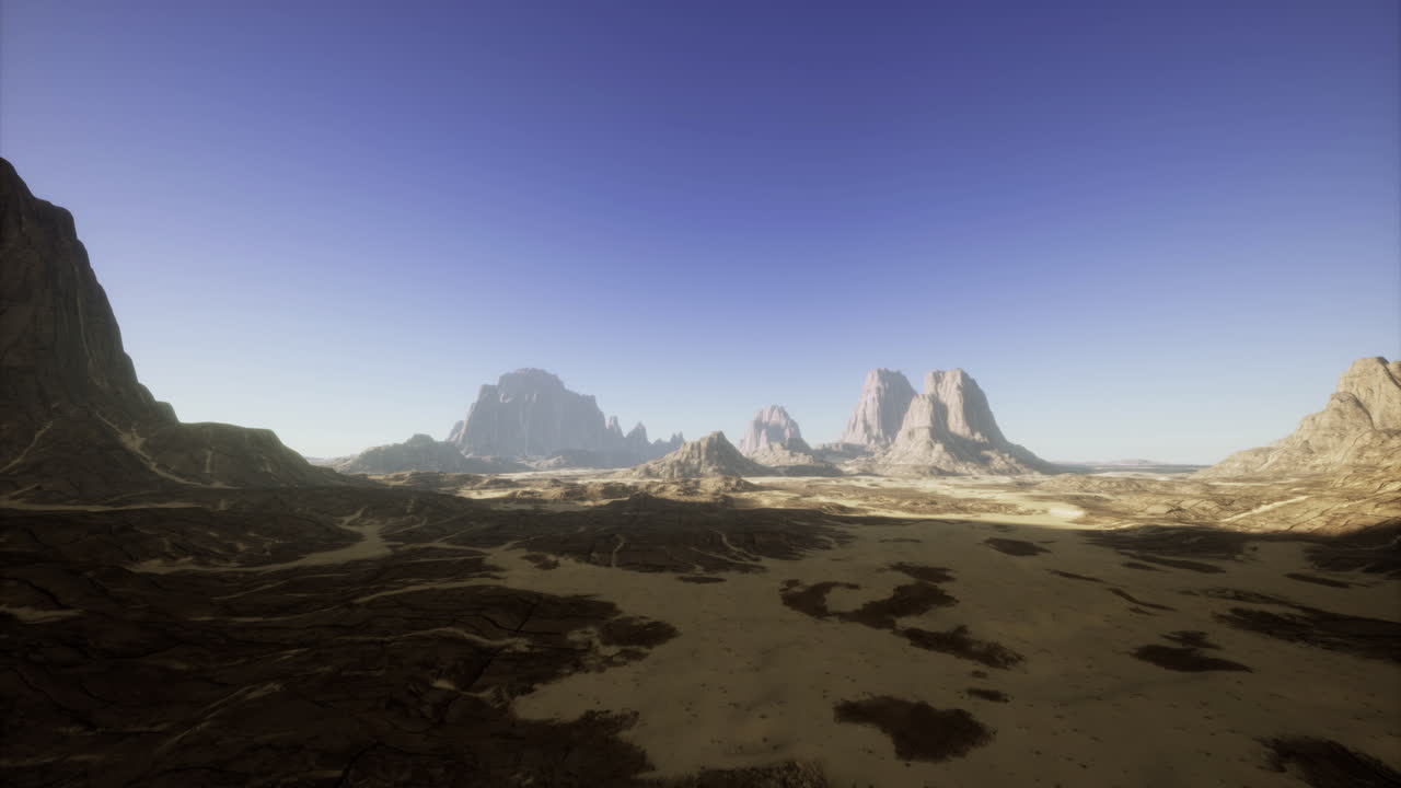 Vast desert landscape bathed in golden sunlight at dusk with distant mountains