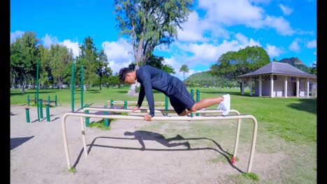 man doing push-ups on parallel bars 4k