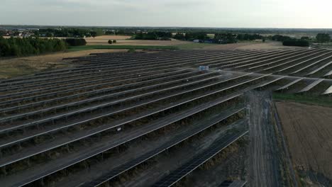 drone above huge photovoltaic farm base station for clean eco green energy production supply electric to smart modern city