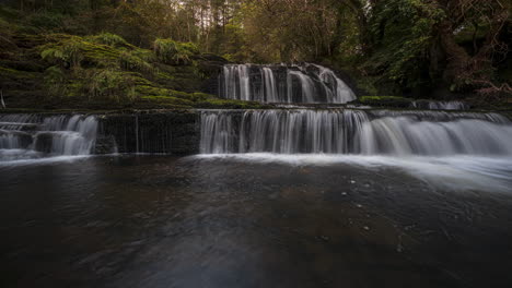 panorama motion time lapse of forest waterfall in rural landscape during autumn in ireland