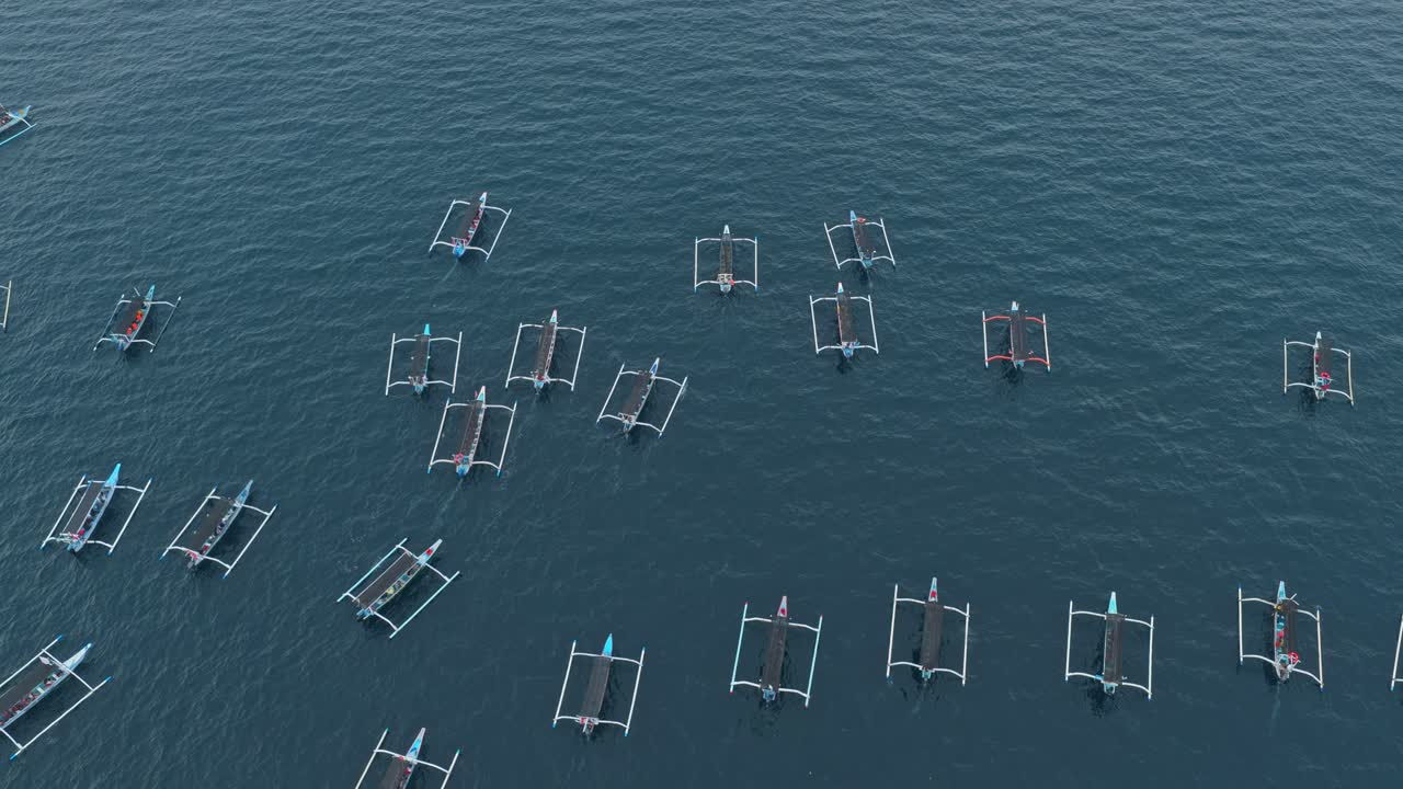 Traditional balinese jukung boats sailing for dolphin watching tour