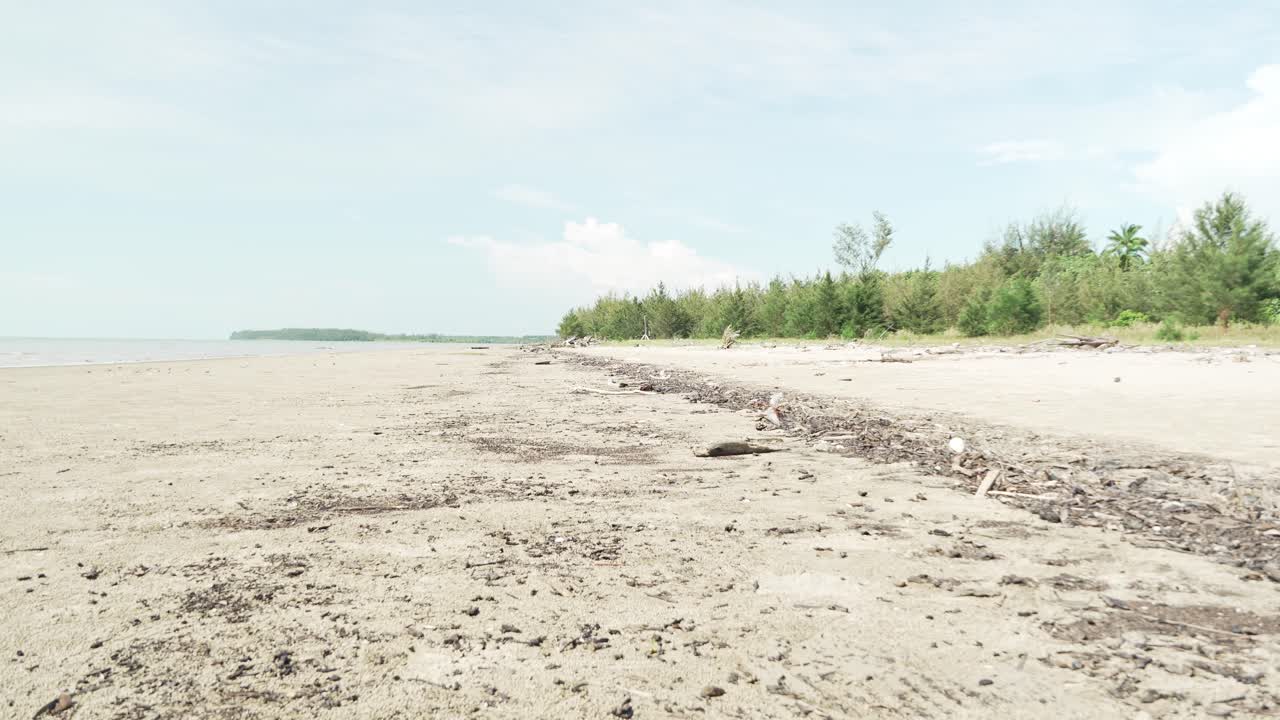 Summer View Of Alit Beach And Fishing Village Kabong,White Sandy Beach,Blue Sea ,Sky And Green Coconut Trees,Sarawak,Borneo.