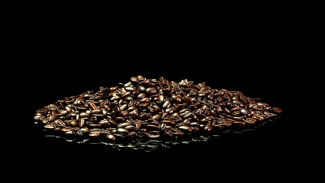 a distant shot of a pile of roasted coffee beans slowly rotating