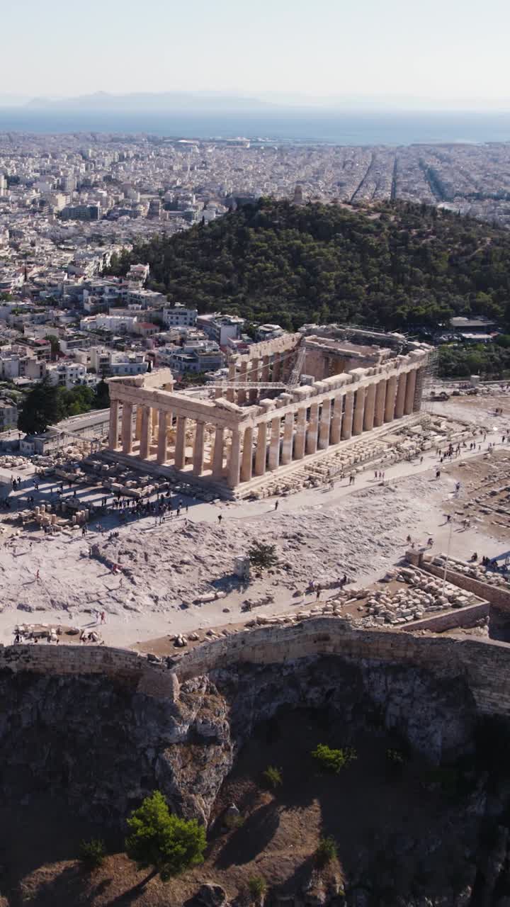 Acropolis, an ancient citadel, sitting above the city of Athens, featuring the Parthenon. Aerial Orbit Motion, Vertical Video