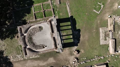 aerial top down ascending shot monument to agonothetes ruins apollonia