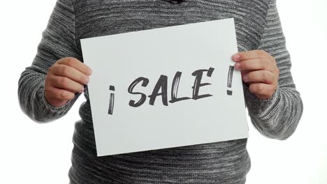 a person holding a sign with the message and the word "sale