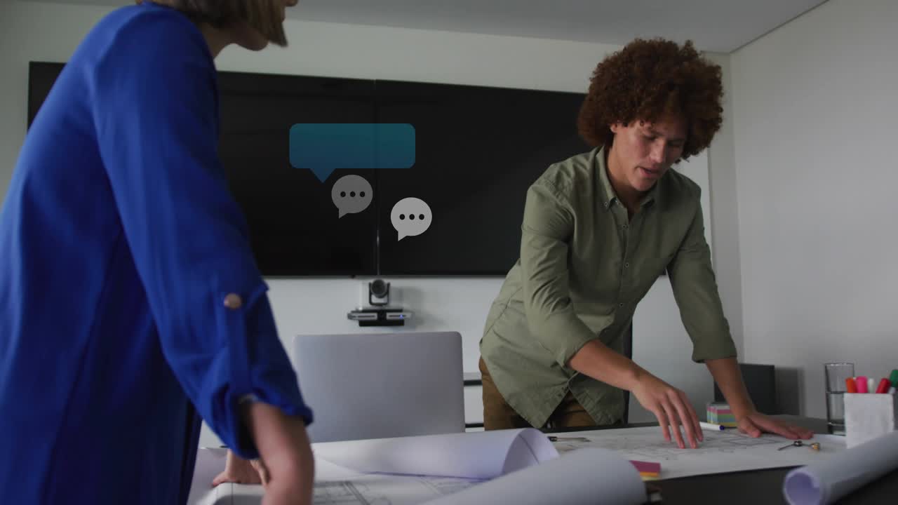 Two coworkers planning engineering plans, talk spawning chat bubbles multiplying then dissipating