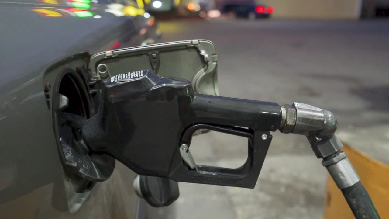 Detail shots of filling up with gas at a rural gas station in the early morning light