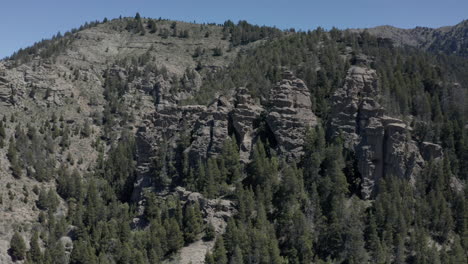 AERIAL---Rock-formations-next-to-Limay-River-in-Valle-Encantado,-Patagonia,-Argentina,-circling