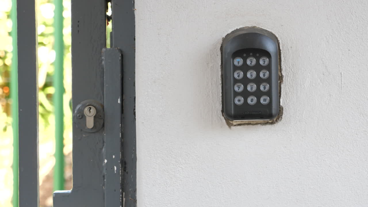 panning shot of alarm keypad and security gate in South Africa