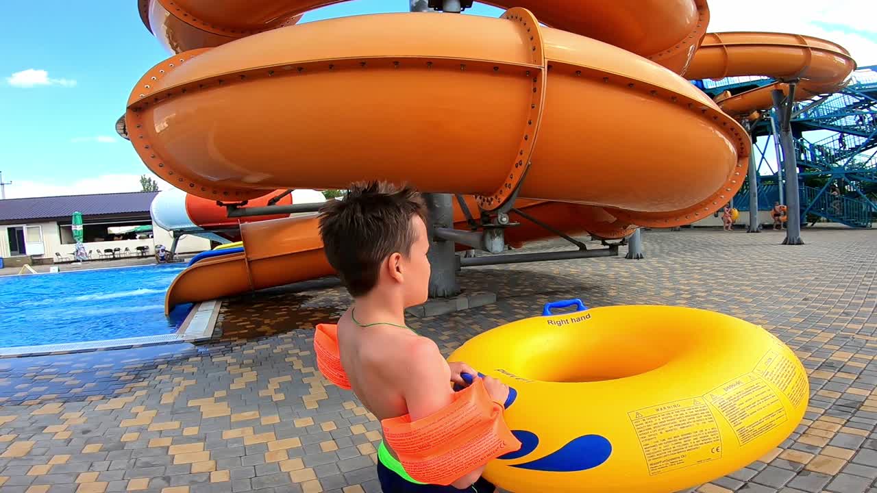 Boy having fun in aqua park