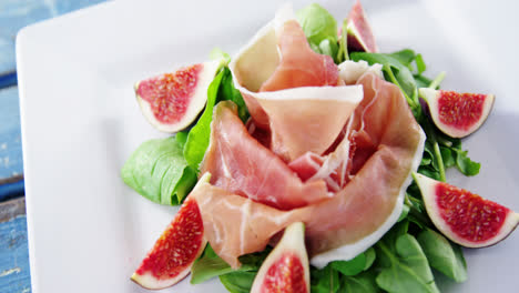 raw meat and vegetables decorated on plate