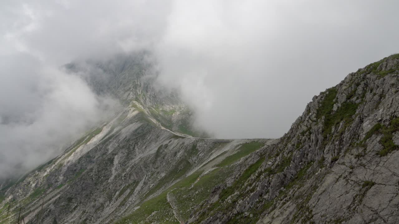 Clouds obscuring the Verdinser Plattespitze mountain range in the Sarntal Alps, South Tyrol, Trentino, Italy