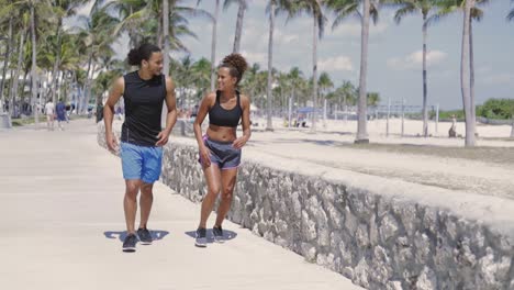 couple interacting while jogging