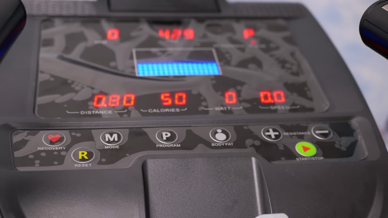 Electronic Indicators of Data on the Monitor a New Modern Elliptical Trainer. 4K