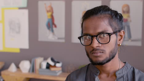 Portrait-Of-A-Serious-Man-Looking-At-Camera-In-An-Animation-Studio