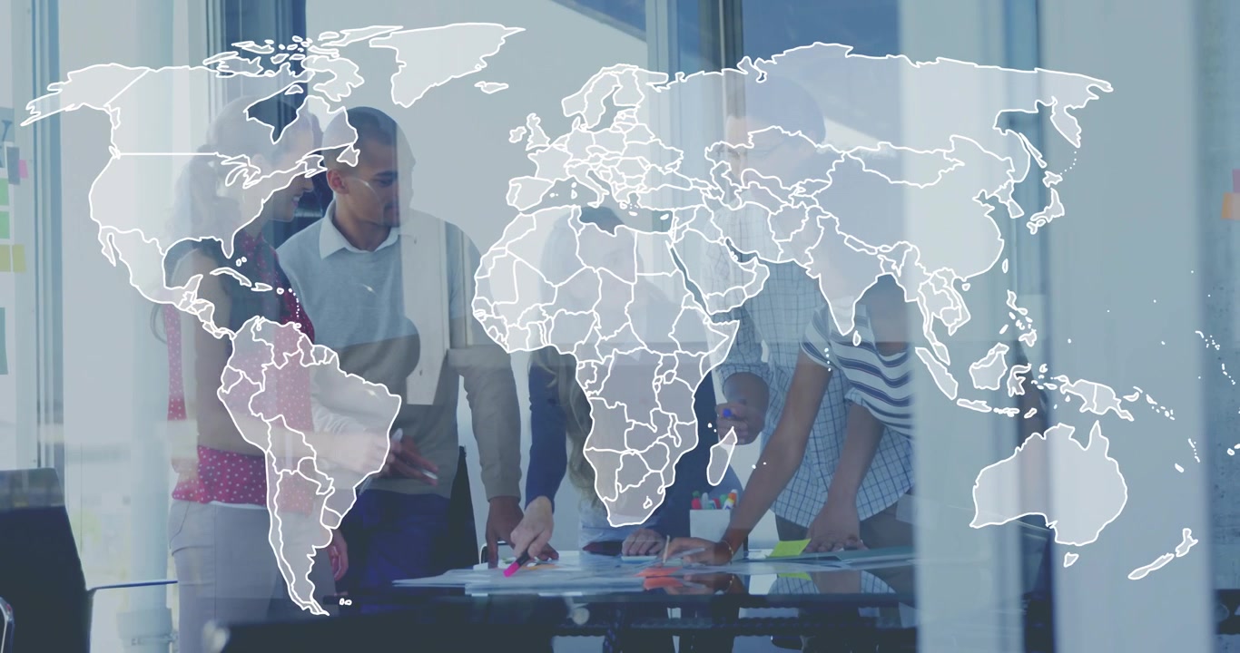 Colleagues reviewing documents and initiating expanding world map overlay during corporate planning