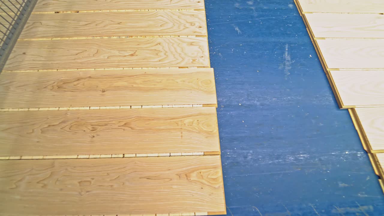 ?lean and smooth boards is going through all the processing steps for getting the final result of parquet for sale on the market. Close-up.