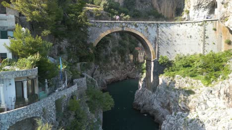 backwards aerial shot reveals famois amalfi coast bridge