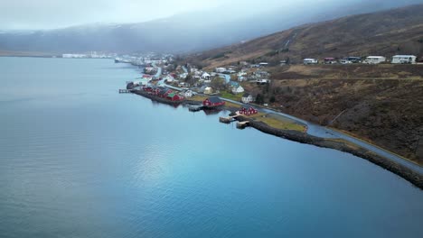 eskifjordur - eskifjörður - colorful village at fjord in east iceland aerial