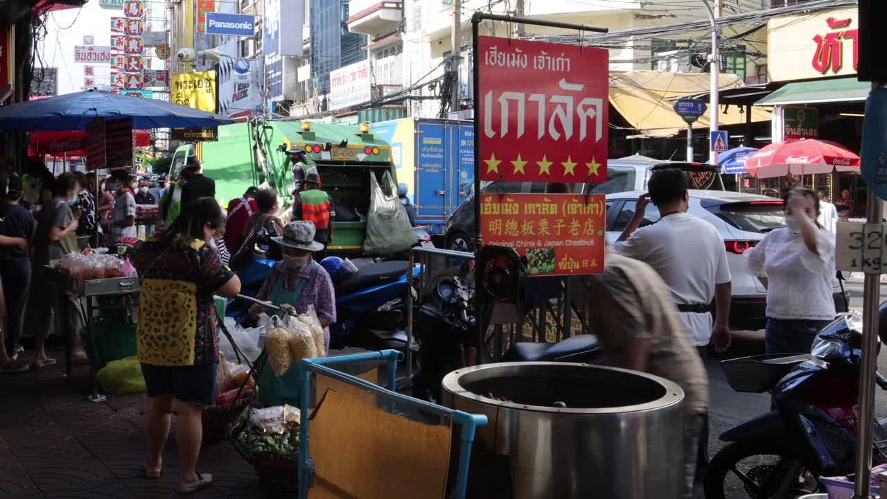 Crowded market scene with vendors and shoppers