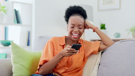 Phone,-typing-and-black-woman-laughing-on-sofa