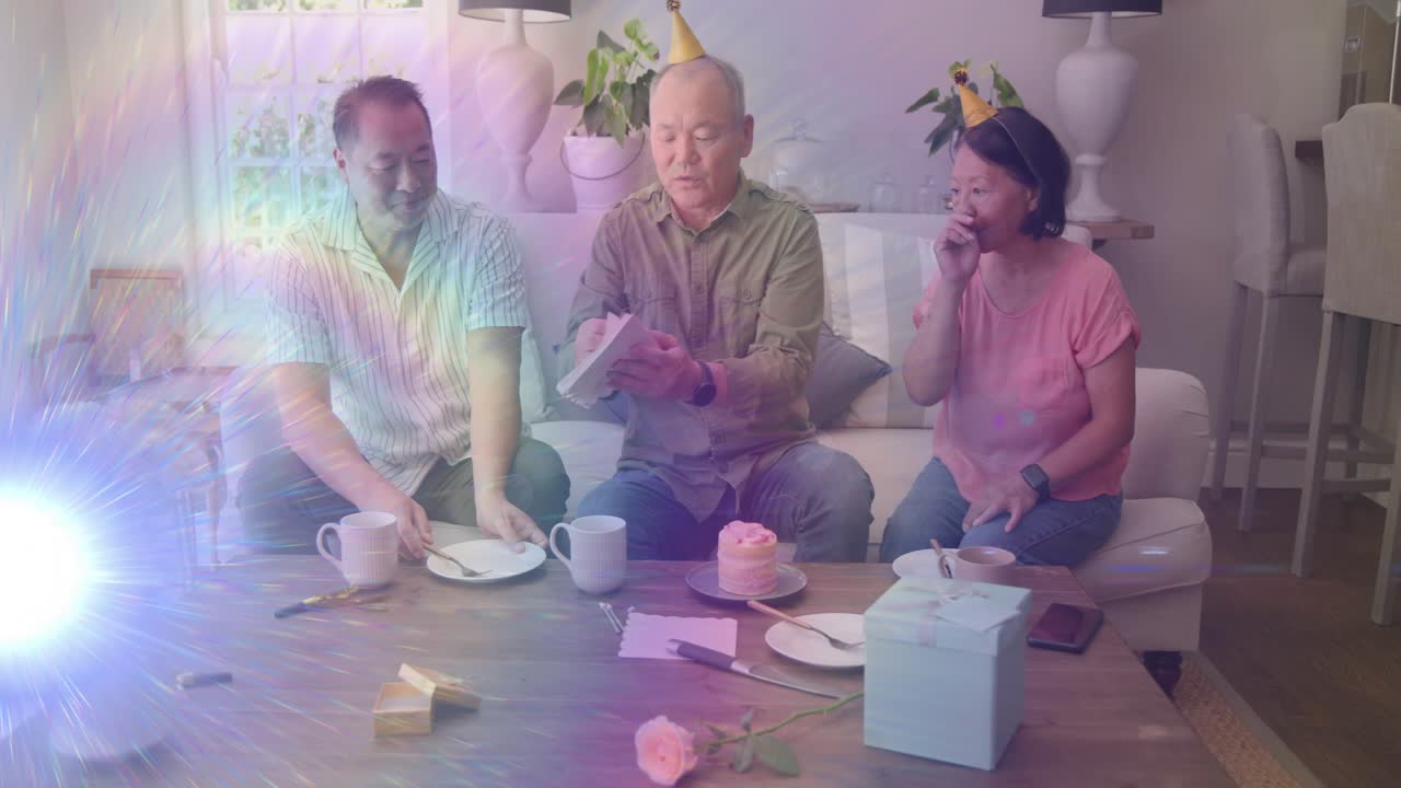 Central man reaching forward, arranging plates and moving cake while preparing gift for hospitality