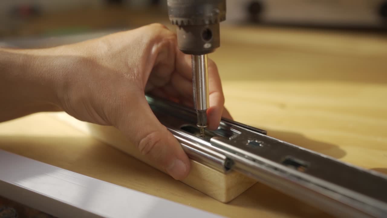 closeup man hand drilling wood, hand made drawer,  Screwdriver Turning A Screw