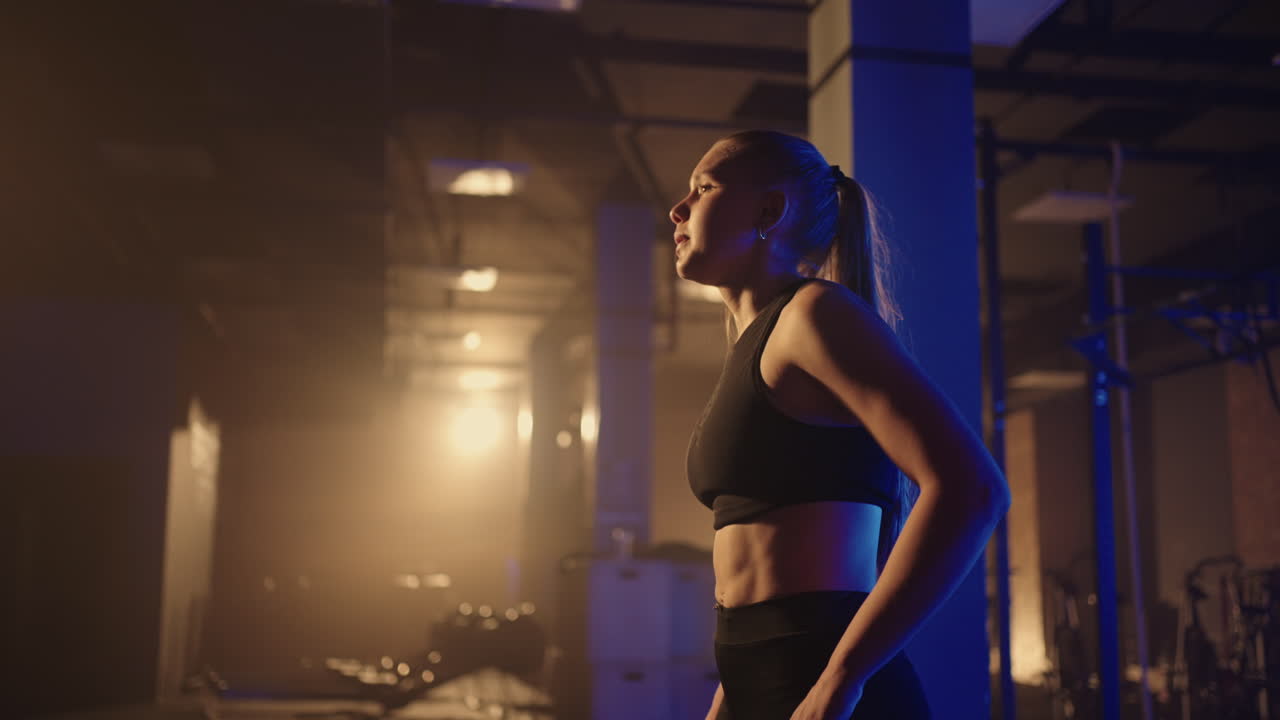 Fitness healthy woman tired after strength training exercise at gym resting relaxing after intense workout. Refreshing And Uplifting