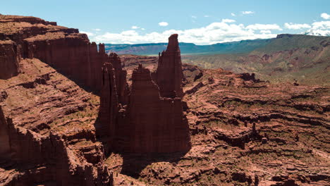 Aerial-hyperlapse-view-of-iconic-red-sandstone-Fisher-Towers-of-Colorado-Plateau