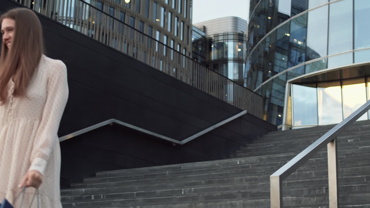 Woman Sliding Down Handrail Outdoors