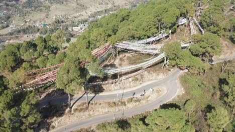 Drone-Aerial-View-of-Buddhist-Flags-flying-in-Himalayas