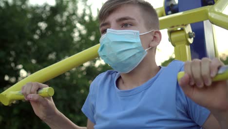 a teenage boy in a medical mask is engaged in sports 12