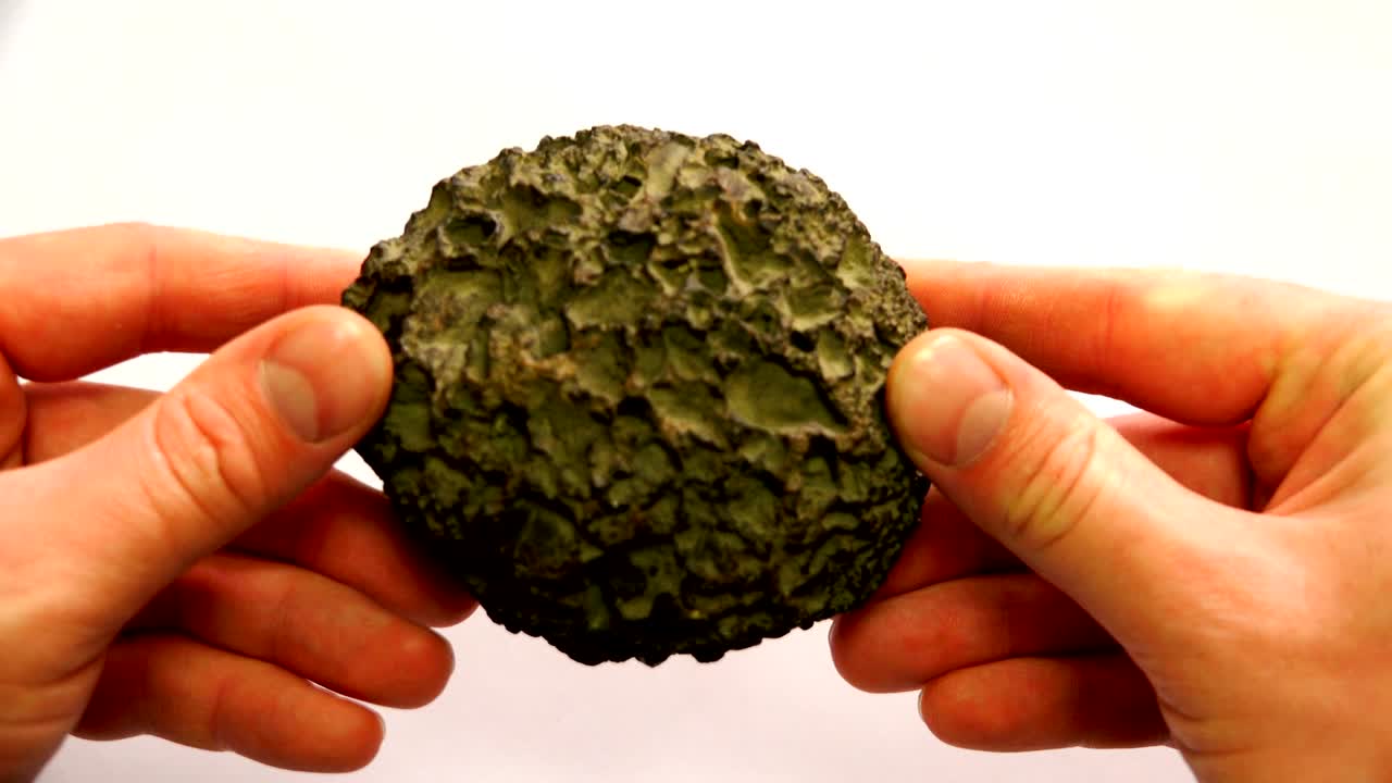 in the form of an irregular circle, a mineral of volcanic origin