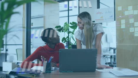 Animation-of-financial-data-processing-over-diverse-female-colleagues-using-laptop-at-office