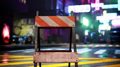 a barricade blocking a street in a neon-lit city at night