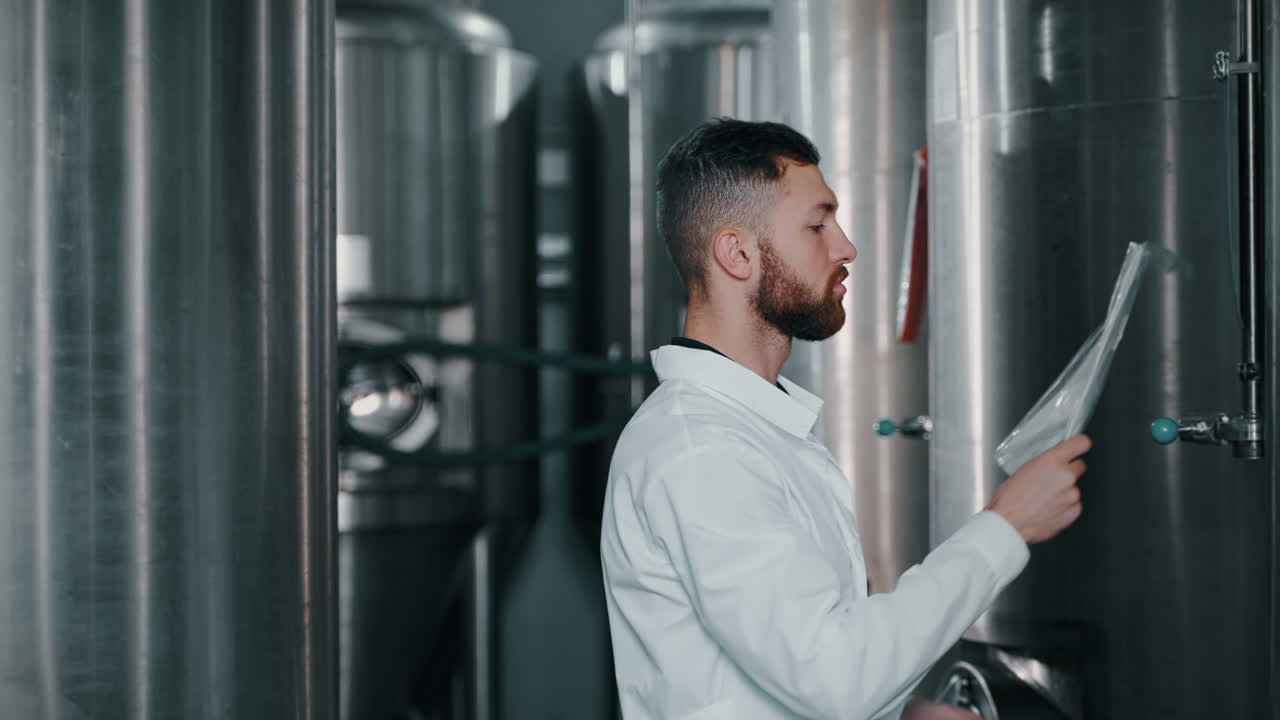 Brewery Worker Inspecting Equipment
